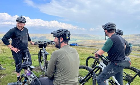 Ard Rock riding bikes with beers