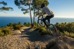 riding mountain bikes high above finale ligure 